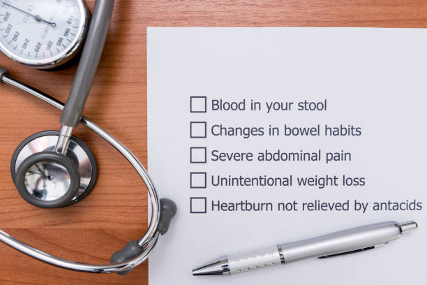 In the doctor's Office There is a form that the doctor made to diagnose the disease that indicate Colon Cancer in a patient. Diagnosis form placed on the doctor's desk.